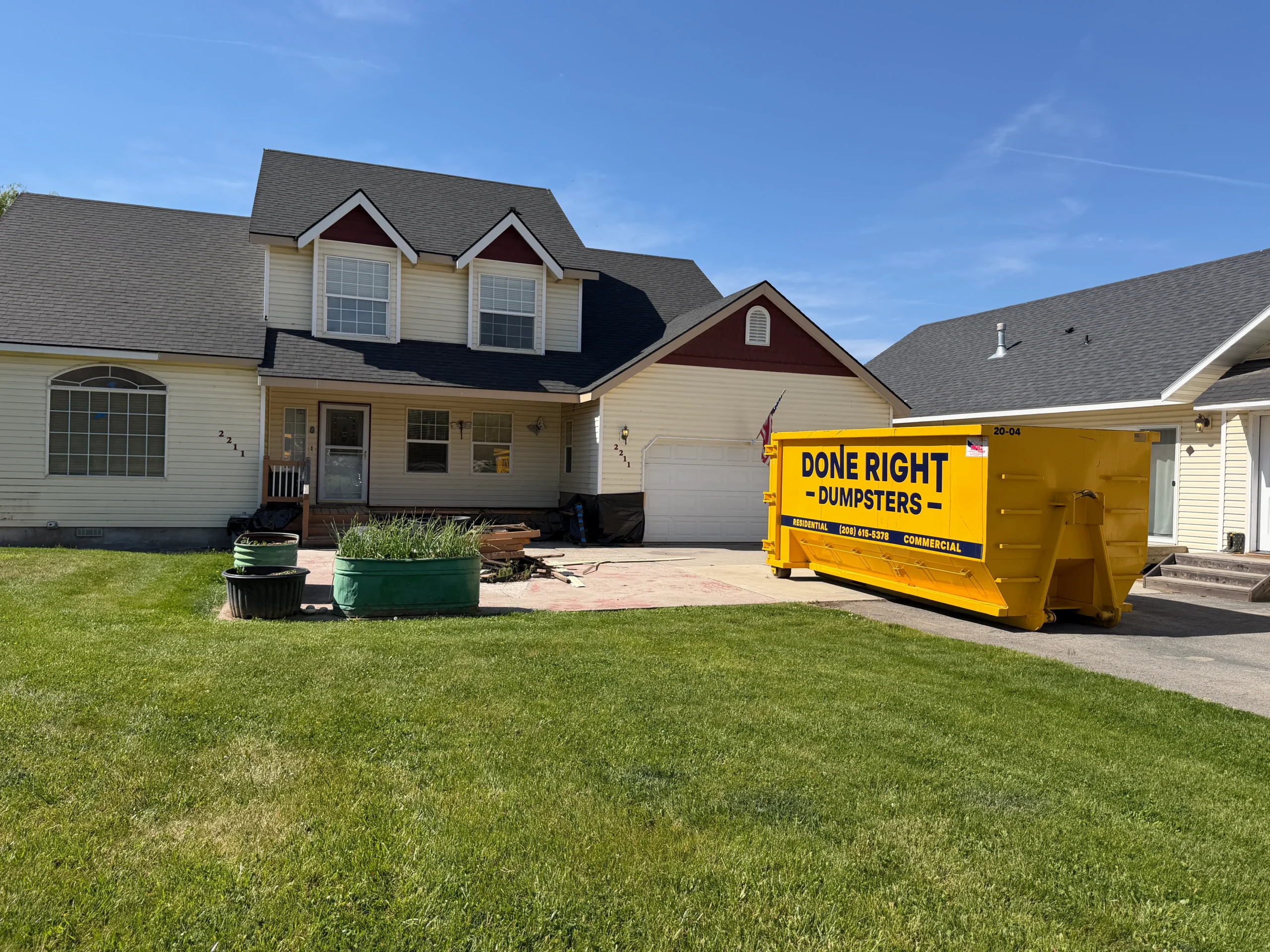 Done Right Dumpsters 20 yard roll-off dumpster in a residential driveway in Nampa Idaho