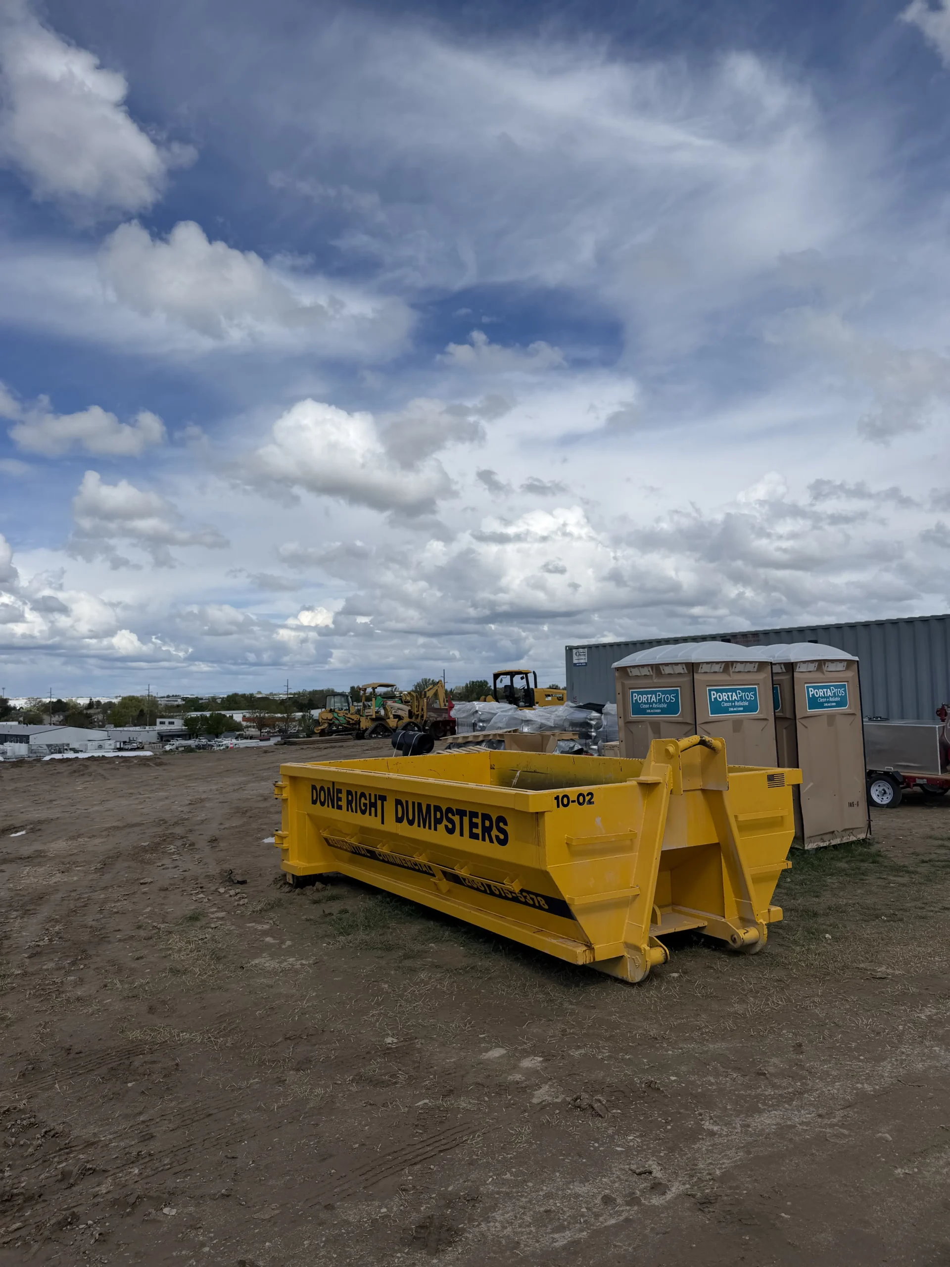 Done Right Dumpsters 10 yard concrete dumpster on a construction site