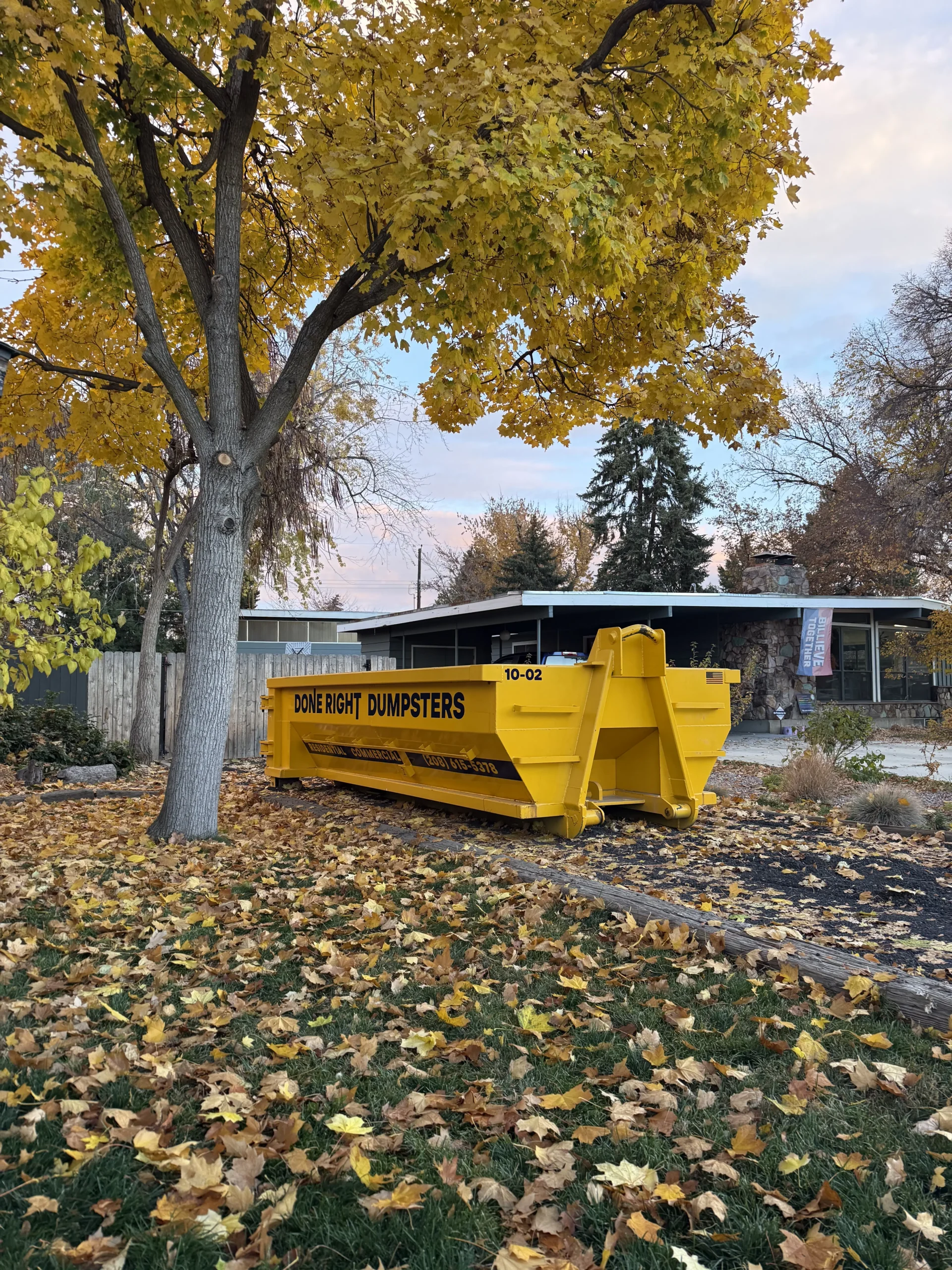 Done Right Dumpsters 10 yard roll-off dumpster in a residential driveway