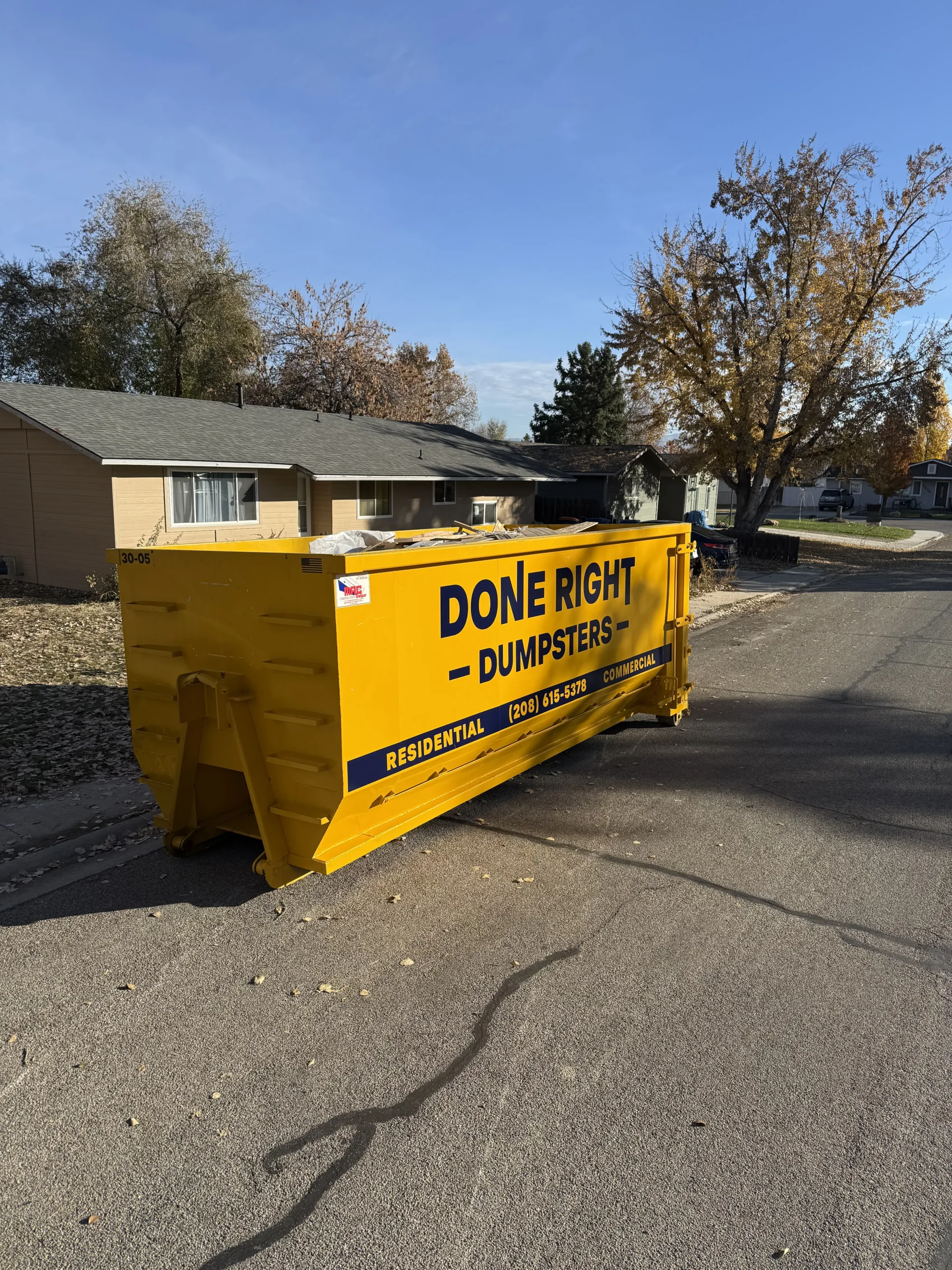 Done Right Dumpsters branded dumpster delivered curbside